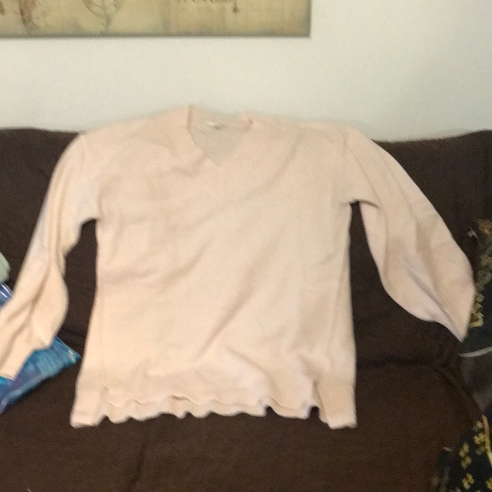 A pink extra large sweater